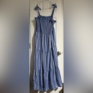 Maxi summer dress with bow tie straps. With white lining underneath.